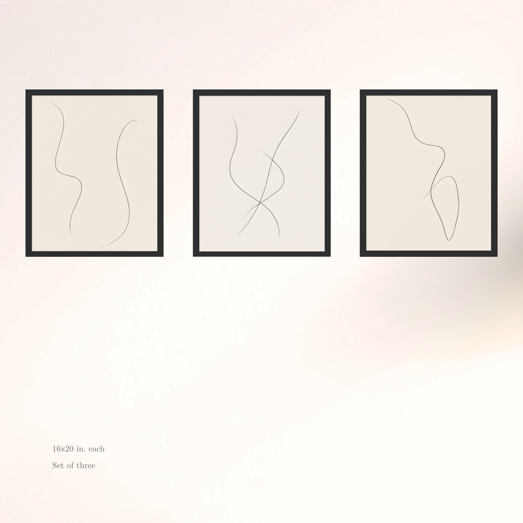 Three framed abstract line art prints on a white wall.