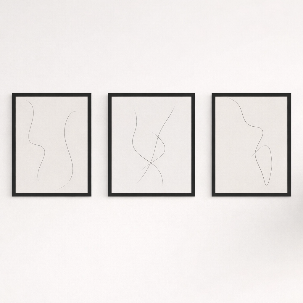 Three framed abstract line art pieces on a white wall
