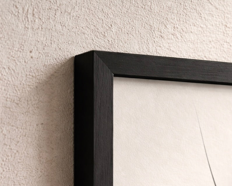 Black picture frame on a textured wall